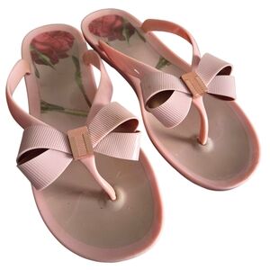 Ted Baker Susie P bow-detail jelly flip-flops in pink.